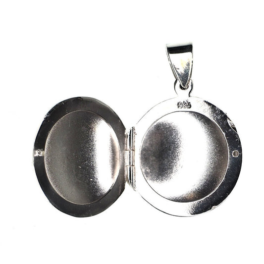 Small round sterling silver locket