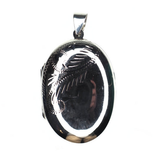 Large oval incised sterling silver locket