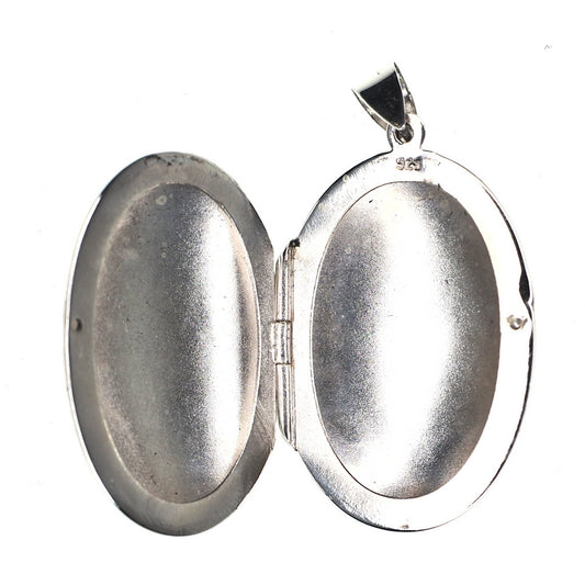 Large oval incised sterling silver locket