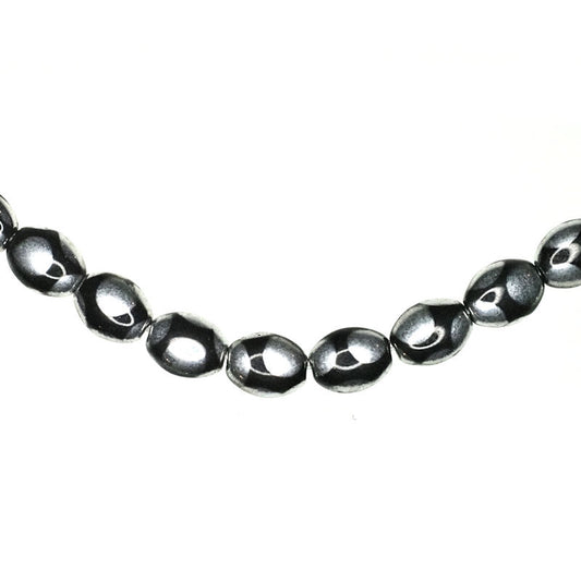 9 mm by 7 mm oval polka dot Czech glass beads