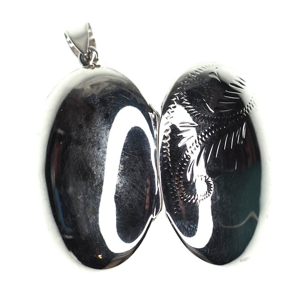 Large oval incised sterling silver locket