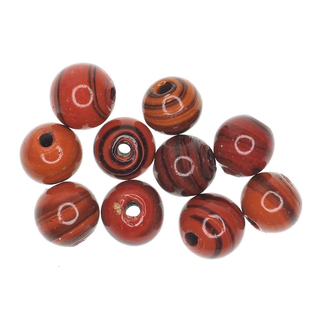 Dark orange striped round glass bead