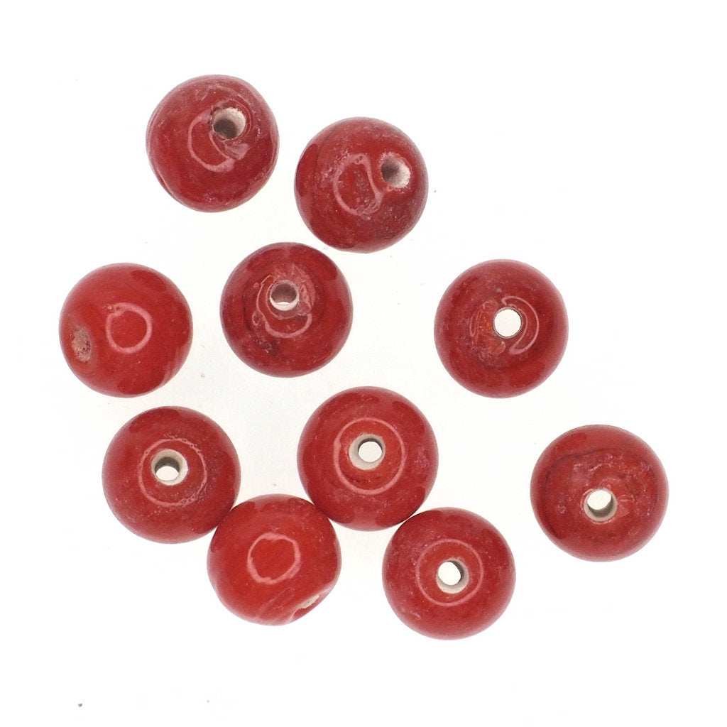 Opaque red round glass bead