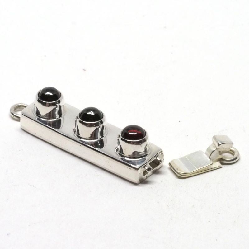 Triple garnet clasp