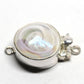 Opalescent white swirl clasp