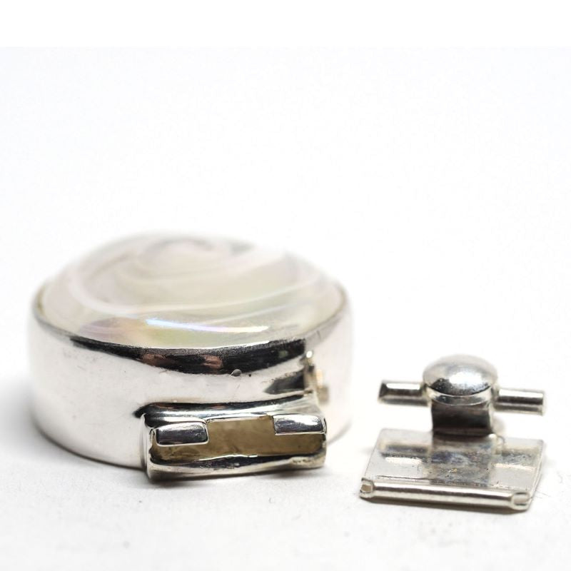 Opalescent white swirl clasp