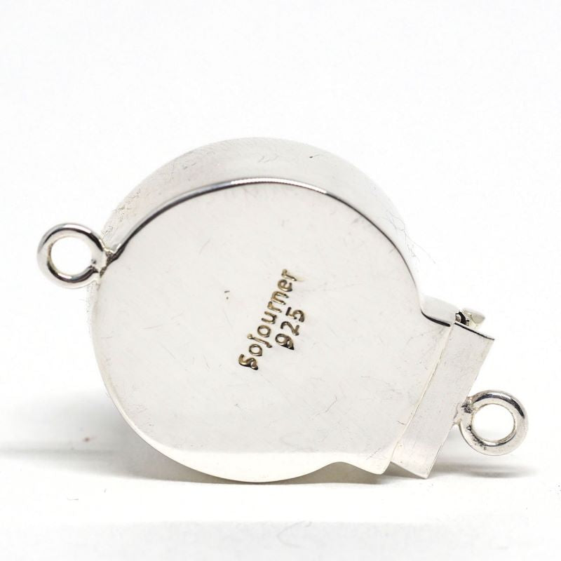 Opalescent white swirl clasp