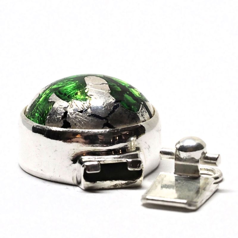 Emerald and silver clasp