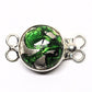 Emerald and silver clasp