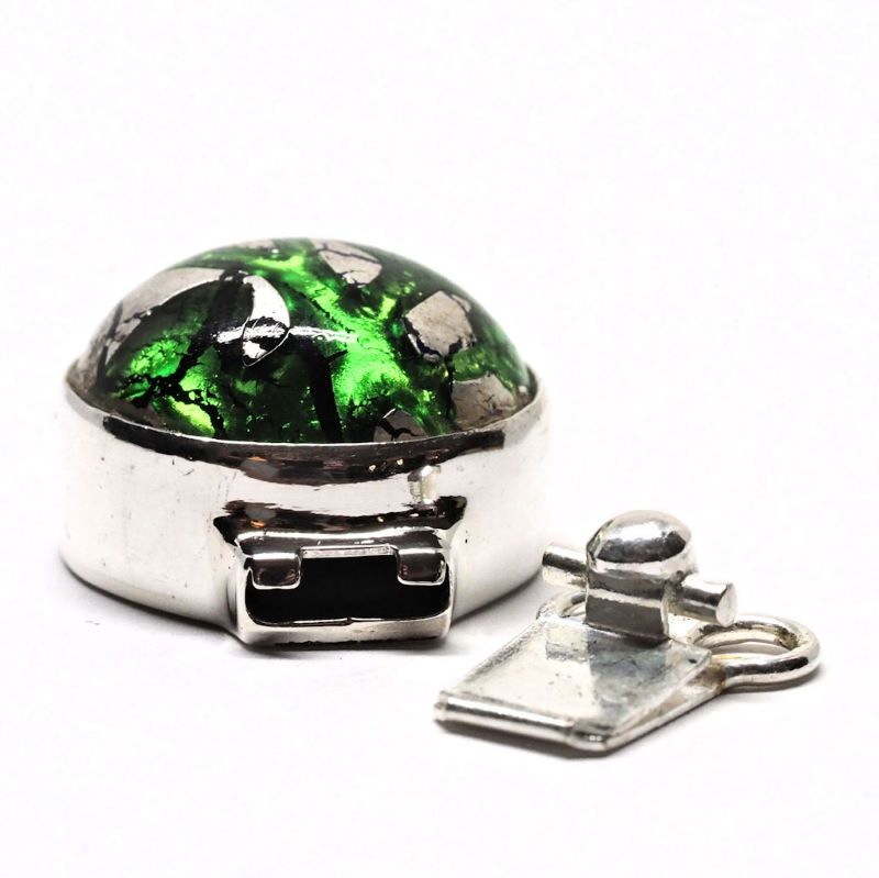 Emerald and silver clasp